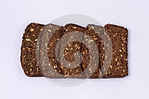 Slised Whole Grain Bread With Sunflower Seeds on Blue Background Top view Tasty Homemade Bread