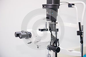 Slit lamp. Biomicroscope. Binoculars. Ophthalmic equipment.. Close up, selective focus. Health care concept. Space for text.