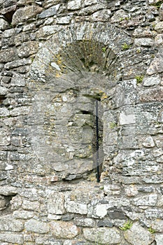 Slit window in stone. photo