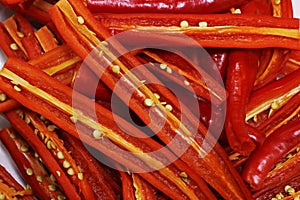 Slitted hot red chilies in close up for food preparation photo