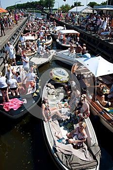 Sloop boats waiting for bridge