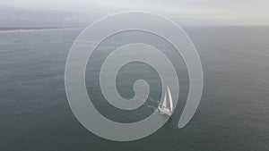 Sloop sailing in calm water