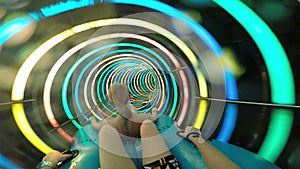 Slope down by water slide in water park. Fun travel inside of the multi color tube at aqua park filmed on action camera