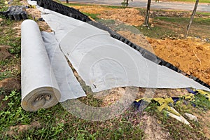 Slope erosion control grids, sheets and earth on steep slope