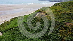 The slope of the hill. Inchydoney beach, drone video, landscape. Beautiful seashore, view from above