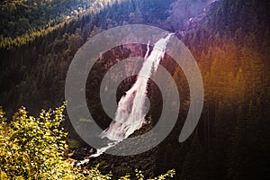 Mountain covered with dense forest and waterfall