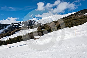 Slope in ski resort Serfaus Fiss Ladis in Austria with snowy mou