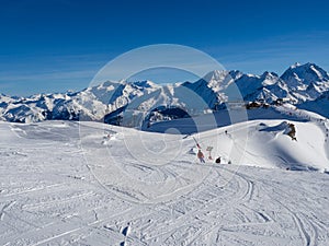 Slope on the skiing resort in Meribel. France, 2018. Blue sky without clouds and white snow.