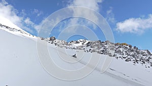 Slopes of mount Elbrus. The lifeguard goes on a snow bike