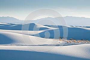 Sloping blueish dunes at White Sand Dunes National Monument