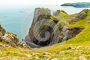 Sloping rock strata at Lydstep Cavens, Wales