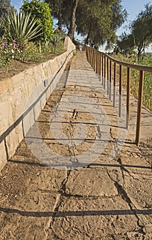 Sloping stone path in rural countryside grounds