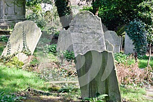 Sloping tombstones in ancient graveyard