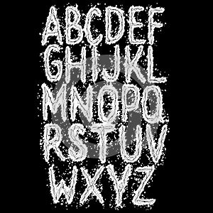 Sloppy grunge alphabet on black background.Art font.