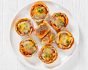 sloppy joe cups on white plate, top view