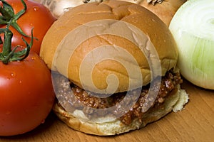 Sloppy joe sandwich with tomatoes onions photo