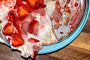 Sloppy strawberry cheesecake mess. Sweet dessert close-up