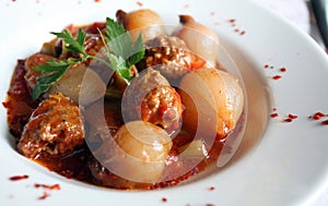 Slops meatballs and onions photo