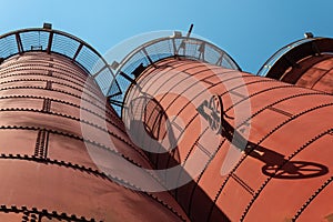 Sloss Furnaces National Historic Landmark, Birmingham Alabama USA, extreme angle looking up at furnaces, open circular catwalks