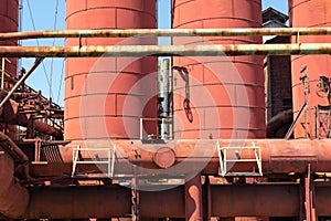 Sloss Furnaces National Historic Landmark, Birmingham Alabama USA, rusted metal plates riveted into round structures, heavy indust