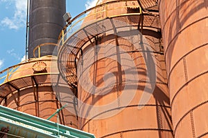 Sloss Furnaces National Historic Landmark, Birmingham Alabama USA, three furnaces with bright orange rust patina on a sunny day, i