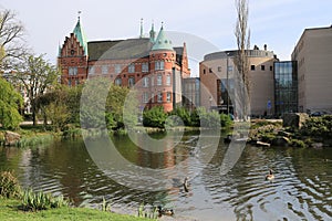 Slottsparken park pond and city library buildings, Malmo, Sweden photo