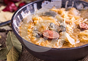 Slovak christmas cabbage soup with mushrooms on natural background.