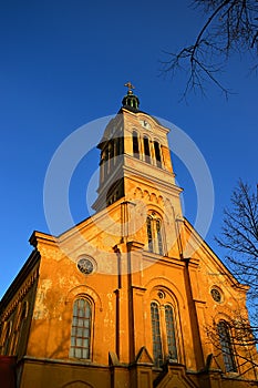 Slovak evangelical Augsburg church in Modra in evening spring sunshine, clear blue skies. Built in neoroman architectural style