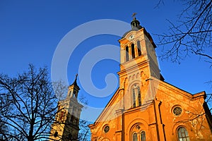 Slovak evangelical Augsburg church in Modra in evening spring sunshine, clear blue skies.