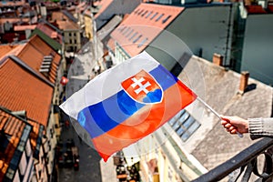 Slovak flag on Bratislava city background