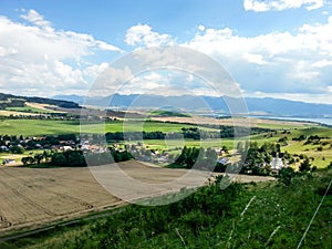 Slovak rural landscape with village and meadows