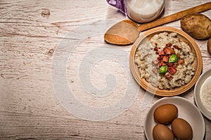 Slovak traditional dishes potato gnocchi with sheep`s cheese, on a wooden table laid on the table