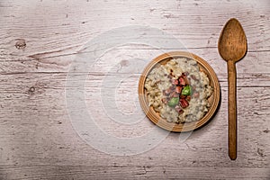 Slovak traditional dishes potato gnocchi with sheep`s cheese, on a wooden table laid on the table