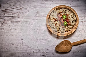 Slovak traditional dishes potato gnocchi with sheep`s cheese, on a wooden table laid on the table