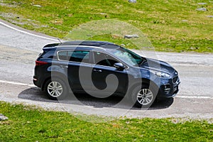 Slovakia, April 24, 2019: Kia Sportage stands on the side of a mountain road