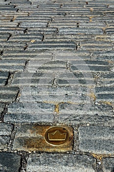 Slovakia, Bratislava. Brass crown marker in cobblestone streets