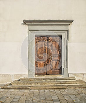 Slovakia, Bratislava - November 5th, 2017 historic old town, buildings from austro-hungarian empire. Entrance wooden door to churc