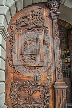 Slovakia, Bratislava - November 5th, 2017 historic old town, buildings from austro-hungarian empire. Entrance wooden door to churc