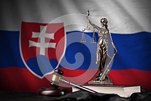Slovakia flag with statue of lady justice, constitution and judge hammer on black drapery. Concept of judgement and