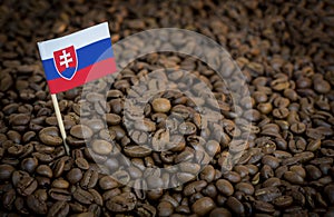 Slovakia flag sticking in roasted coffee beans. Concept of export and import