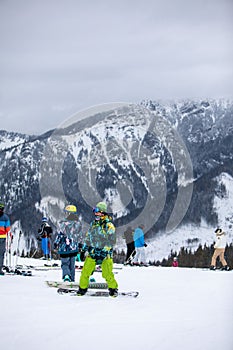 Slovakia, Jasna - February 4, 2022: winter mountains view ski resort slopes people skiing and snowboarding