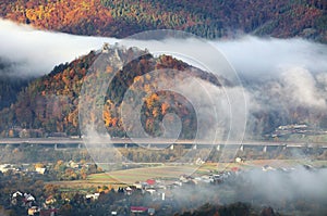 Slovakia landscape with village and ruin of castle Povazsky hrad at autumn