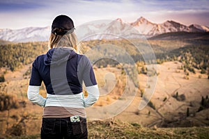 Slovakia mountain landscape. Nature fields. High Tatras, Europe, Belianske Tatry. Happy woman is standing in mountains.