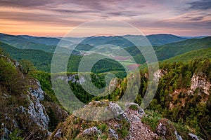Slovakia - Muranska planina, green spring mountain landscape. Beautiful sunrise and colorful sky.