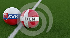 Slovakia vs. Denmark Soccer Match - Leather balls in Slovakia and Denmark national colors.