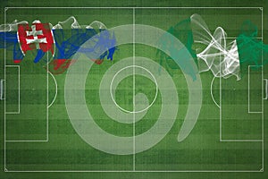 Slovensko vs nigéria futbalový zápas, národné farby, národné vlajky, futbalové ihrisko, futbalový zápas, kopírovať priestor