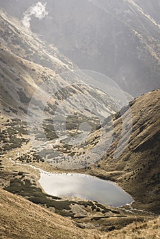 Slovakian carpathian mountain lake in autumn - vintage film look