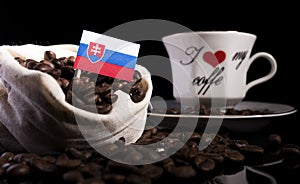 Slovakian flag in a bag with coffee beans on black