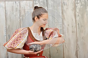 Slovakian girl holding painted easter eggs