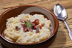 Slovakian halusky served with sheep cheese and roasted bacon